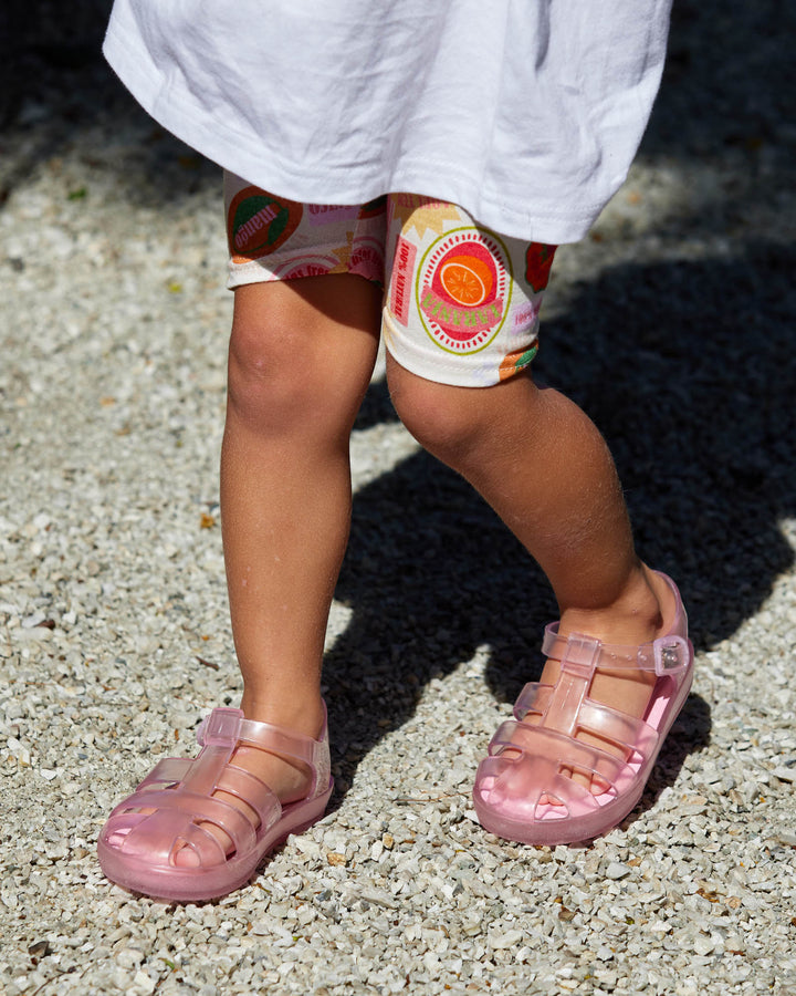 Child wearing Frankie Sandals in Pink